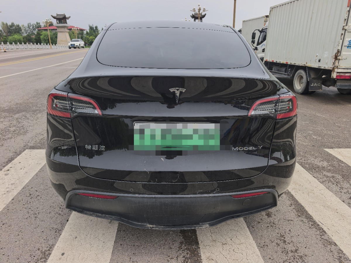 Tesla Model Y 2024 #4 Tesla Model Y 2024 car image #4