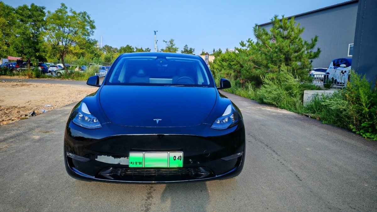 Tesla Model Y 2024 #5 Tesla Model Y 2024 car image #5
